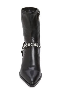 Polished studs highlight the harness strap of a moto-chic bootie complete with a pointy toe. 2 1/4" heel (size 8.5) 7" shaft Side zip closure Synthetic and leather upper/textile, synthetic and leather lining/synthetic sole Imported Edgy Studded Ankle-high Boots, Edgy Studded High Heel Boots, Edgy High Heeled Boots With Studs, Edgy High-heeled Boots With Studs, Edgy High Heel Moto Boots With Rivets, Punk Heeled Boots With Studs For Fall, Punk Style Studded Heeled Boots For Fall, Punk Stud Heeled Boots For Fall, Punk Studs Heeled Boots For Fall