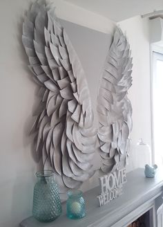 a large white sculpture sitting on top of a mantle