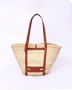 Do you want to look stylish and hippy? Get your hands on this handmade straw bag. It's high quality, eco-friendly, and handcrafted by women in Morocco. Its design is unique and timeless. Get yours now! we are proud to introduce our signature straw french bag to you. it is handmade by our talented artisan who has been working with us for years. this beautiful bag has a unique design that you would find nowhere else. the light and durable material are ideal for taking the bag on your adventures. S Chic Summer Shoulder Bag With Leather Trim, Chic Summer Bags With Leather Trim, Bohemian Bucket Shoulder Bag For Travel, Summer Vacation Shoulder Bag With Leather Trim, Chic Vacation Shoulder Bag With Leather Trim, Chic Shoulder Bag With Leather Trim For Vacation, Chic Brown Shoulder Bag For Vacation, Chic Brown Vacation Shoulder Bag, Rectangular Summer Bags With Leather Trim