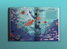 an open children's book with illustrations of animals and fish in the ocean, on a blue background