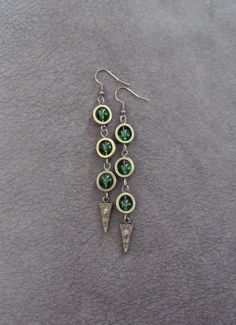 Green glass and bronze earrings on French hooks Bronze Metal Earrings With Lever Back, Vintage Bronze Beaded Earrings, Ornate Handmade Green Earrings, Vintage Beaded Bronze Earrings, Bohemian Bronze Beaded Nickel-free Earrings, Nickel-free Bronze Chandelier Earrings, Nickel-free Green Glass Earrings, Bronze Earrings, Earrings Geometric