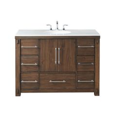 an image of a bathroom vanity with drawers and two faucets on the sink