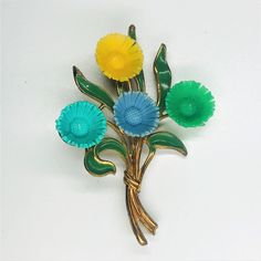 Lovely vintage antique celluloid flower floral brooch pin. gold toned repoousse raised metal with green enamel leaves. rivet set with hook clasp. very good condition for its age. measures 3 inches thanks for looking free shippinhg to US br22 Please visit my other vintage Etsy sites: www.vintagebrooches715.etsy.com www.vintagenecklaces6715.etsy.com www.vintagebooks715.etsy.com www.garagesale715.etsy.com www.vintageearrings715.etsy.com Floral Brooch, Pearl Brooch, Hook Clasp, Red Rhinestone, Green Enamel, Rhinestone Brooches, Pink Rhinestones, Clear Rhinestones, Vintage Flowers