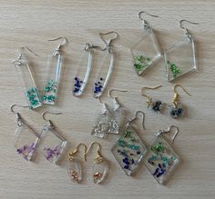 Crushed glass in resin drop earrings. Trendy Handmade Clear Jewelry, Trendy Clear Resin Jewelry, Hypoallergenic Resin Jewelry For Parties, Clear Resin Jewelry With Pressed Flowers, Trendy Glass Jewelry As A Gift, Handmade Clear Rectangular Jewelry, Clear Resin Earrings, Glass In Resin, Glass Designs