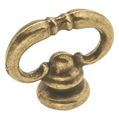 an antique brass plated metal handle on a white background