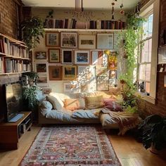 a living room filled with furniture and lots of books on the wall above it's windows