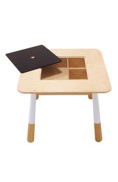 a wooden table with an open drawer on it