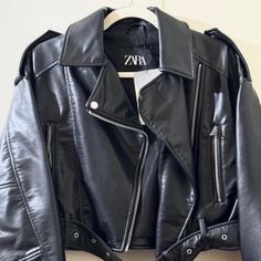 Elevate Your Style With This Zara Faux Leather Crop Biker Jacket, A Must-Have For Fashion-Forward Individuals. This Authentic Jacket Is Brand New With Tags, Ensuring You Receive It In Pristine Condition. Premium Faux Leather: Achieve The Edgy Look With High-Quality Faux Leather That Looks And Feels Like The Real Deal. Stylish Crop Design: The Cropped Cut Adds A Modern Twist To The Classic Biker Jacket, Perfect For Layering Over Your Favorite Outfits. Versatile Size S: Designed To Fit Comfortably Zara Leather Biker Jacket For Work, Zara Leather Jacket For Streetwear, Chic Leather Outerwear For Biker Events, Zara Moto Outerwear For Streetwear, Chic Zara Biker Jacket With Zipper Closure, Zara Leather Biker Jacket With Zipper Closure, Zara Biker Jacket With Zipper Closure, Zara Black Biker Jacket With Zipper, Zara Black Leather Biker Jacket