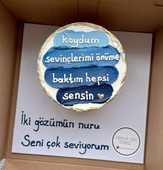 a cake in a box with words written on the top and below it is an advertisement for seki cok sevigorum