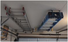 a ladder that is attached to the ceiling above a garage door