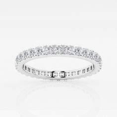 a white gold ring with rows of round brilliant cut diamonds