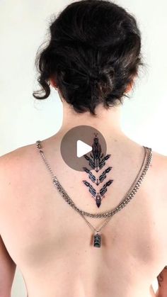 a woman with a tattoo on her back