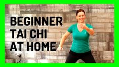 a woman is standing in front of a brick wall with the words beginer tai chi at home