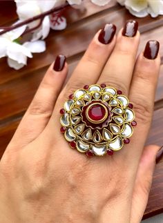 Shine like a glowing star in this exquisitely designed  ruby stone kundan ring. Pair it up with your silks and satins to add charm and charisma to your beautiful personality.   Ring is adjustable so can fit any size comfortably Item is ready to be shipped from New Delhi, India Gold Rings For Diwali Festival, Gold Kundan Toe Ring, Festive Gold Kundan Ring, Traditional Ruby Rings For Wedding, Traditional Ruby Wedding Rings, Silver Kundan Toe Ring, Kundan Rings For Festivals And Gifts, Festive Kundan Ring Jewelry, Gold Rings With Stone Work For Festive Occasion