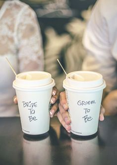 two people holding coffee cups with the words welcome to me written on them