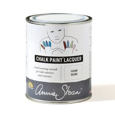 a can of chalk paint sitting on top of a white table