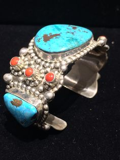 "- This listing is just for the one cuff that appears alone in the pictures... The others are also available in my shop in the section titled \"Fine Jewelry\". Please have a look... Highly regarded & collectible, Wayne Aguilar of Santo Domingo Pueblo, Native American Indian made multi-stone highly decorated sterling silver cuff... Stones include Turquoise (2, one with pyrite), coral (6) & chrysocolla (1, with malachite & cuprite). Silver studs form surrounding patterns around stones. Unique Blue Ceremonial Jewelry, Unique Blue Jewelry For Ceremonial Occasion, Unique Sterling Silver Cuff Bracelet Collectible, Silver Artisan Multi-stone Cuff Bracelet, Artisan Silver Multi-stone Cuff Bracelet, Artisan Sterling Silver Cuff Bracelet For Collectors, Unique Ceremonial Sterling Silver Cuff Bracelet, Navajo Silver Jewelry, Silversmith Jewellery