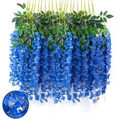 blue flowers with green leaves hanging from the ceiling