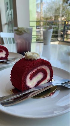 a piece of red velvet cake on a white plate