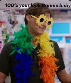 a man wearing sunglasses and a fake flower in front of him with the caption 100 % your look connie baby