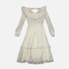 Vintage Dress 1960s Size: small Measurements: armpit to armpit: 13” top to bottom: 47” Vintage Cream Mini Dress With Ruffles, Fitted Cream Vintage Mini Dress, 1950s Ruffled Vintage Dress For Spring, Vintage Ruffled Midi Dress For Evening, 1970s Style Dresses With Ruffles, 1970s Style Dresses For Spring Vintage Events, 1970s Style Spring Dresses For Vintage Events, 1970s Style Dresses For Vintage Events In Spring, Vintage Cream Midi Dress With Ruffles