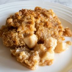 a close up of a plate of food with crumbs and bread on it