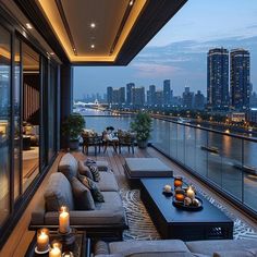 a living room filled with lots of furniture next to a large window covered in candles