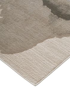 an area rug that has been placed on top of a white floor with grey and beige colors