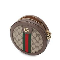 Made in Italy, the Ophidia mini shoulder bag from Gucci features a round silhouette, chain shoulder strap, brown leather trim, gold-tone hardware, and the brands signature green and red webbing.Zipper pullBeige/ebony GG Supreme canvasBrown leather trim. Shiny gold-toned hardware. Green and red Web. Double G. Microfiber lining with a suede-like finish. Chain strap with 22.5" drop. Zip closure with Double G. 7"W x 7"H x 2"D. Composition: Canvas 100%, Nylon 100%, Leather 100%Lining: Microfibre 100% Red Web, Mini Shoulder Bag, Green And Red, 7 H, Bag Tags, Shoulder Handbags, Chain Strap, Gucci Bag, Leather Trims