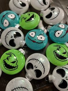 some green and white buttons with faces on them