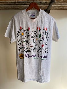 Vintage deadstock Flambeaux Mambo New Orleans Mardi Gras T-shirt. Size medium adult by Hanes Beefy T. Made in the USA. 97% cotton. Single stitch. Small spot faint can be washed Band Merch T-shirt For Fan Merchandise, Deadstock Cotton Crew Neck T-shirt, Crew Neck Cotton T-shirt Deadstock, Cotton Crew Neck T-shirt Deadstock, New Orleans Mardi Gras, Mambo, Mardi Gras, Made In The Usa, New Orleans