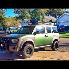 a pick up truck parked in front of a house