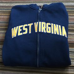 Nike West Virginia Hoodie Size Small Full Zip Up Front Navy Blue With Gold Lettering. New Without Tags Nike Collegiate Hoodie For Fall, Nike Collegiate Hooded Hoodie, Nike Collegiate Hoodie, Nike College Hooded Sweatshirt, Nike Hooded College Sweatshirt, Nike Hooded Sweatshirt For College, Nike Winter Outerwear For College, Navy Hooded Sweatshirt For Fall, Nike Collegiate Sweatshirt For Winter