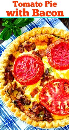 a tomato pie with bacon and tomatoes on top, sitting on a blue checkered table cloth