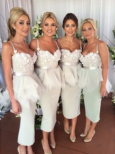 the bridesmaids are all dressed in white