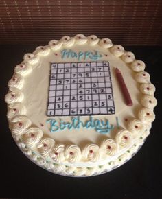 a birthday cake with a sud puzzle on it