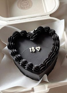 a heart shaped cake with the number eighteen on it