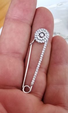 "2 Solid Sterling Silver 925  Pave Round Safety Pin bail Nappy Pin Diaper charms clasp brooch with clear CZ sold by pairs size: 4.30 mm x 10 mm x 3 mm (1.70 inches x 2/5  inches x 1/8 inches) weignt: 5 grams/2 safety pins  Note: We have many safety pins with or without CZ. search for \"safety\" word in to find other safety pins    Description: 2 Solid Sterling Silver 925  Pave Round Safety Pin bail Nappy Pin Diaper charms clasp brooch with clear CZ" Silver Cubic Zirconia Jewelry With Brooch, Formal Safety Pin Brooch, Silver Safety Pin Earrings For Gift, Gold Safety Pin Lapel Brooch, Silver Safety Pin Brooch For Gift, Silver Safety Pin Shaped Brooch, Safety Pins, Leaf Charms, Safety Pin