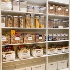 an organized pantry filled with lots of food and storage bins on the bottom shelf