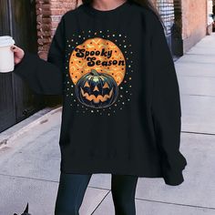 Check out our awesome Halloween sweatshirt! All of our sweatshirts feature a unique design that's totally original and bursting with personality. Take a look at the photos for more details. I had a blast creating the design for this sweatshirt, and I hope you'll love wearing it just as much. They're perfect for adding some fun and flair to your everyday look, especially during the colder months. Grab one now and rock a piece of art! Details: - Sizing: These are unisex-sized sweatshirts. If you'r Spooky Halloween Crew Neck Sweater, Black Halloween Graphic Print Sweatshirt, Oversized Fall Sweatshirt With Character Print, Spooky Oversized Halloween Sweatshirt, Oversized Spooky Halloween Sweatshirt, Black Cartoon Print Sweater For Fall, Black Sweater With Cartoon Print For Fall, Halloween Graphic Print Sweatshirt, Halloween Character Print Sweatshirt For Streetwear