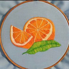 an embroidery project with oranges on it