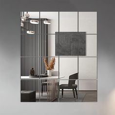 an office with modern furniture and decor in grey tones, as seen through the glass wall