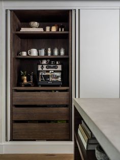 an open cabinet with many items on it