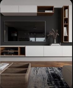 a modern living room with black walls and white entertainment center, large rug on the floor