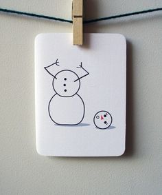 a small white card with a drawing of a snowman and an egg on it