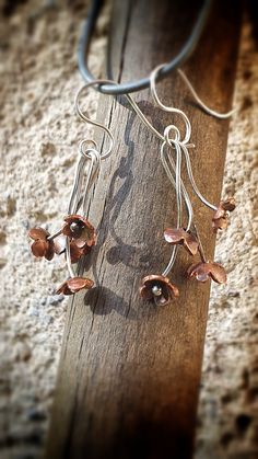 Little copper flowers set into a sterling silver bouquet. Great for a original gift.  Made with love in my workshop! :) Handmade Copper Flower Earrings, Silver Bouquet, Copper Flowers, Copper Earrings, Original Gift, Flowers Bouquet, Bouquets, Etsy Earrings, Etsy Accessories