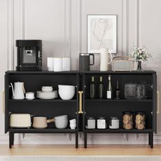 a black shelf filled with lots of white dishes and cups on top of wooden floors