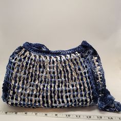 ♡ Handmade with love by my lovely mom in a smoke-free home ♡ Size: width - 6 inches (at widest), height - 8  inches, length - 10 inches, handle - 36 inches Features: -upcycled can aluminium tabs -crocheted with nylon thread (very durable!) -purse comes lined with fabric  -2 inner pockets -zipper closure Color- Blue Tie Dye *Actual colors may vary slightly due to lighting Blue Reusable Shoulder Bag For Daily Use, Blue Rectangular Upcycled Shoulder Bag, Blue Upcycled Shoulder Bag For Everyday Use, Everyday Blue Upcycled Shoulder Bag, Eco-friendly Blue Crochet Bag For Everyday, Eco-friendly Blue Crochet Bag, Blue Reusable Shoulder Bag For Everyday Use, Blue Reusable Tote Shoulder Bag, Soda Can Tabs