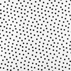 a black and white polka dot pattern on a sheet of paper