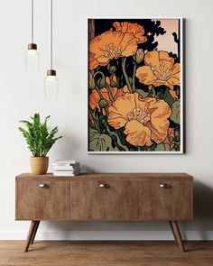 an orange flower is on the wall next to a wooden dresser